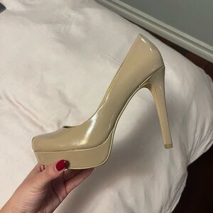 Well worn tan pump heels